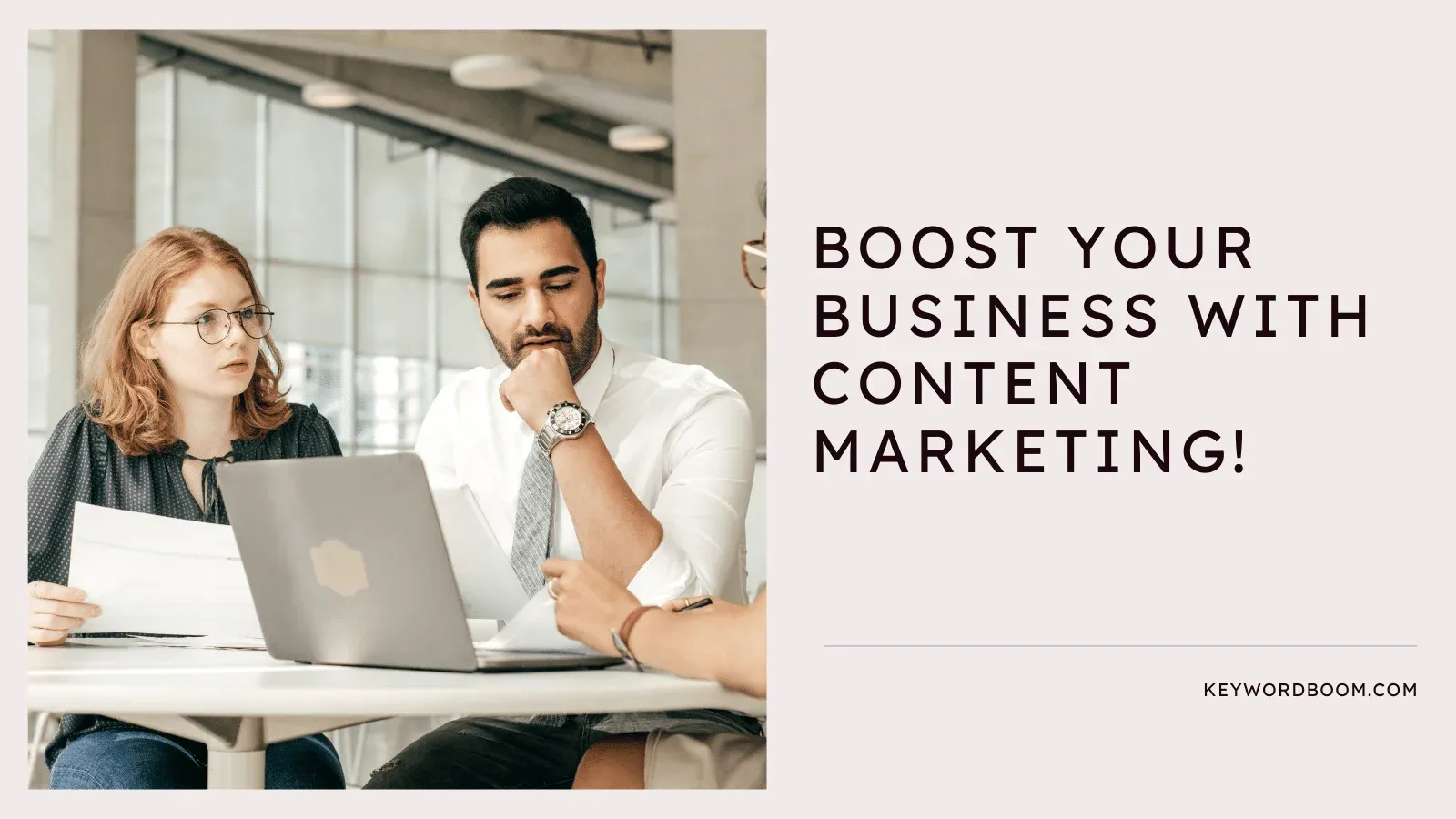 Two professionals discussing over a laptop with text "Boost your business with content marketing!"